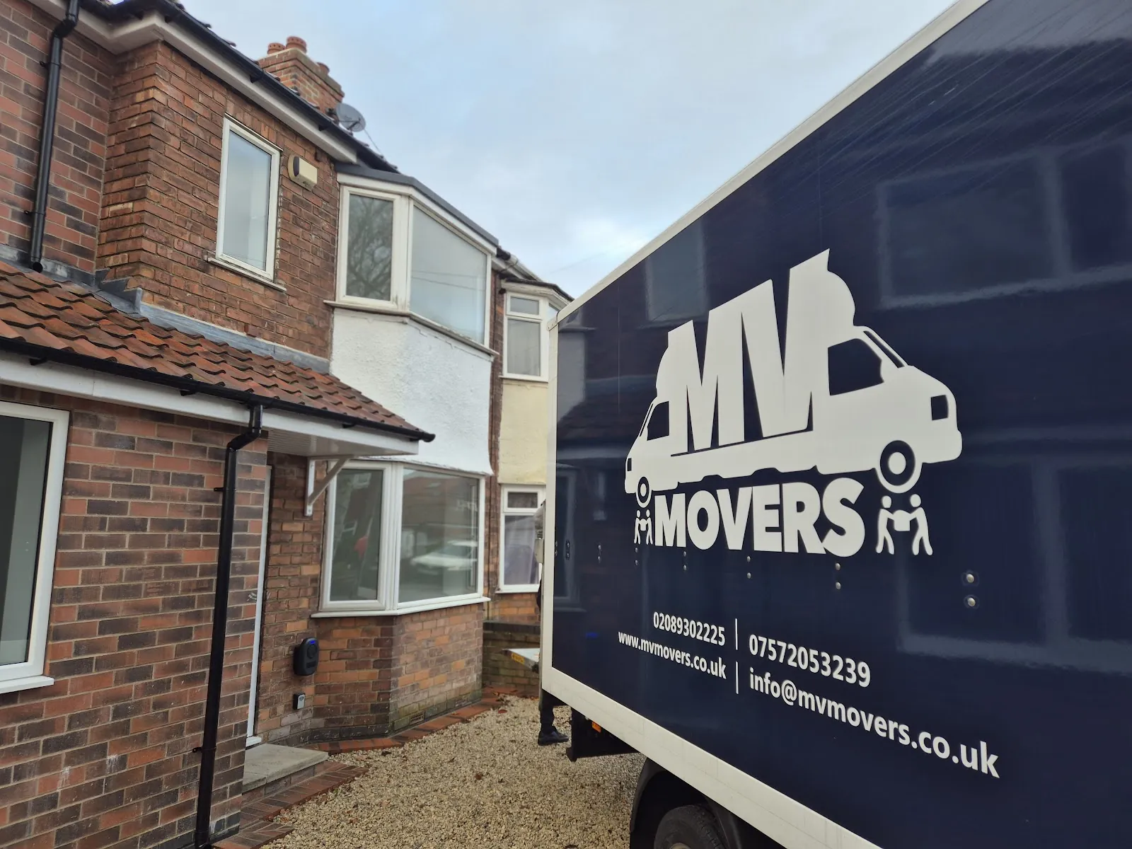 MV van outside a semi-detached house