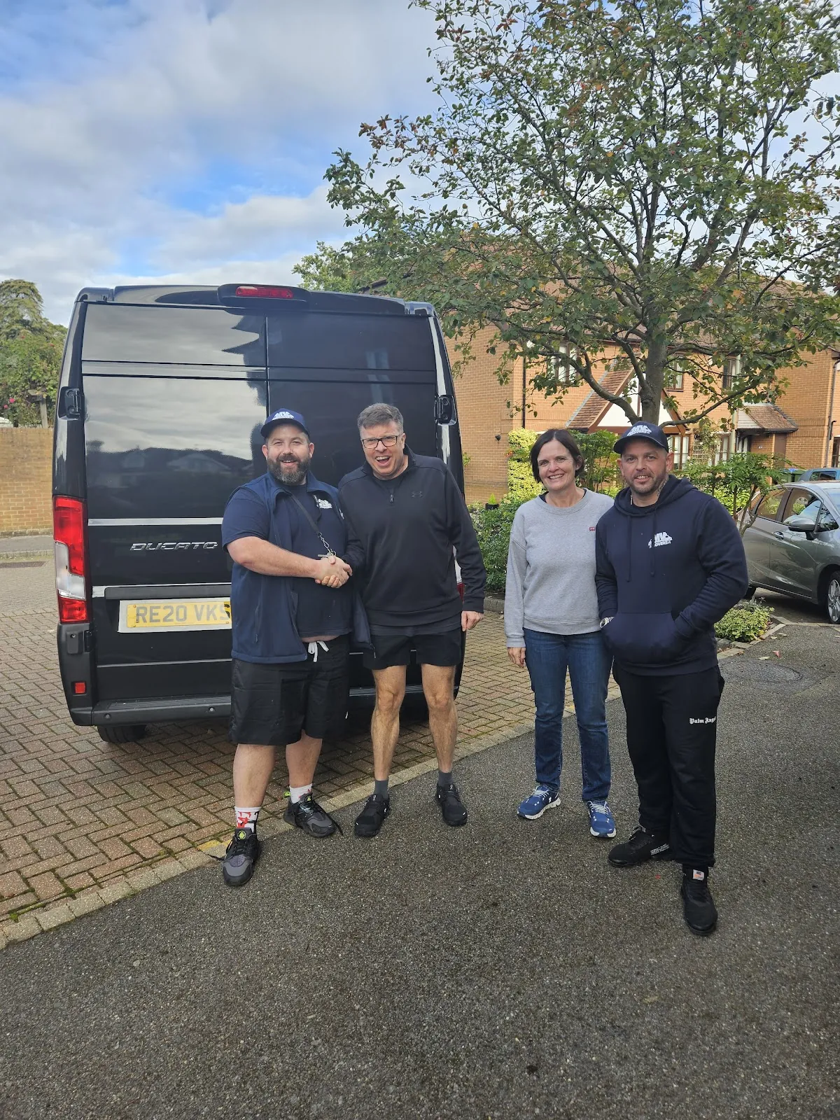 Four crew members with the van